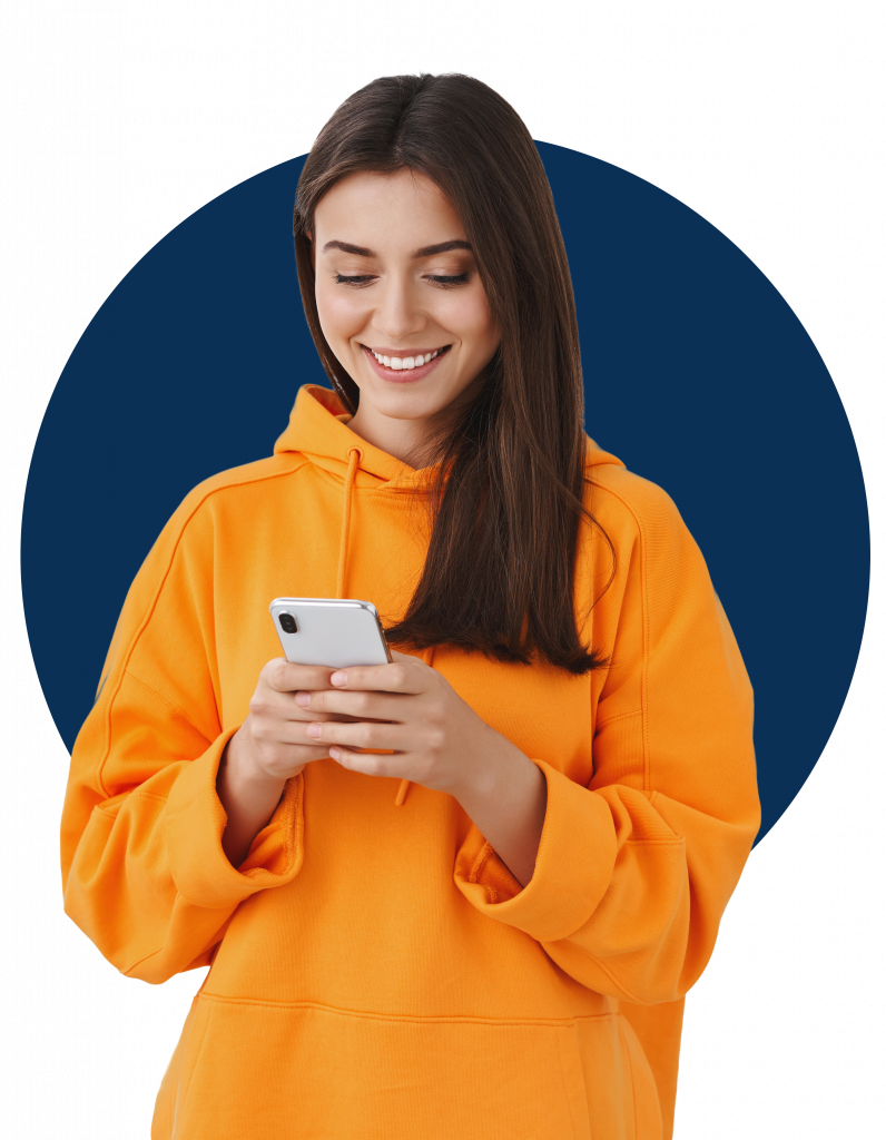 charismatic-pretty-brunette-girl-orange-hoodie-smiling-looking-mobile-phone-screen-as-texting-messaging-with-boyfriend-using-phone-application.png
